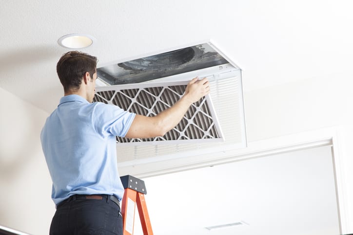 Precision Technician replacing air filter