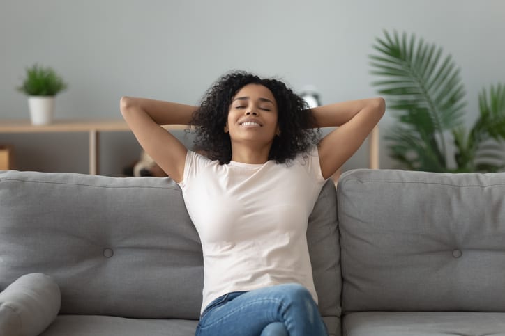 Woman enjoying Clean Air in home